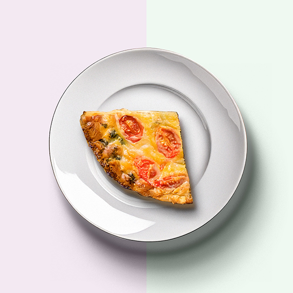 Quiche slice served on plate