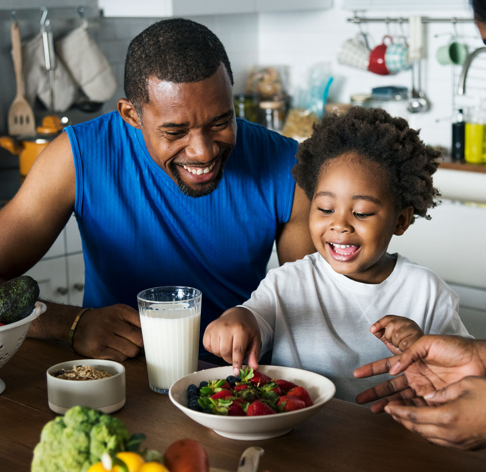 Family enjoying healthy meal together at kitchen table