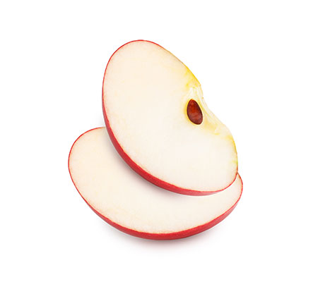 Two apple halves stacked, displaying seeds inside.