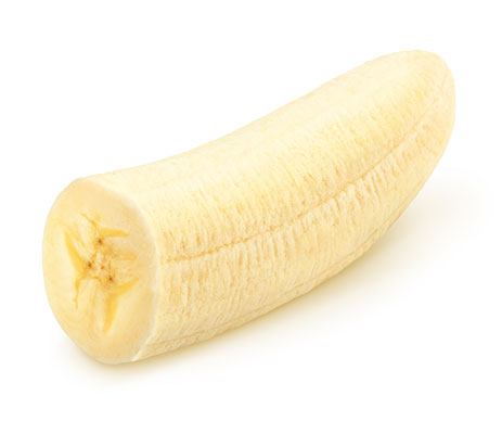 Half-peeled banana resting on white background.