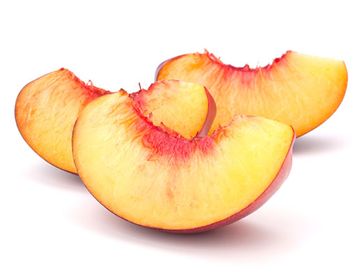 Sliced peaches with vibrant, juicy interiors.