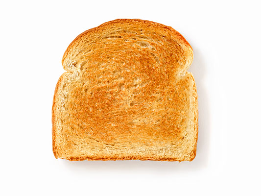 Slice of toasted bread against white background.